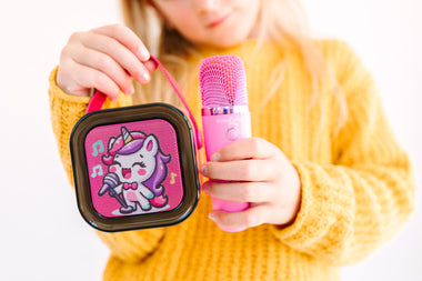 Kids Mini Karaoke Machine featuring 20+ pre-loaded kid songs like Twinkle Twinkle Little Star and Wheels on the Bus. Connects to phone or tablet via Bluetooth for playing songs from Spotify, YouTube, and Apple Music. Portable, durable design perfect for playdates and open mic nights. Includes 4 voice effects and echo mode for quality sound. Rechargeable battery provides up to 6 hours of playtime.